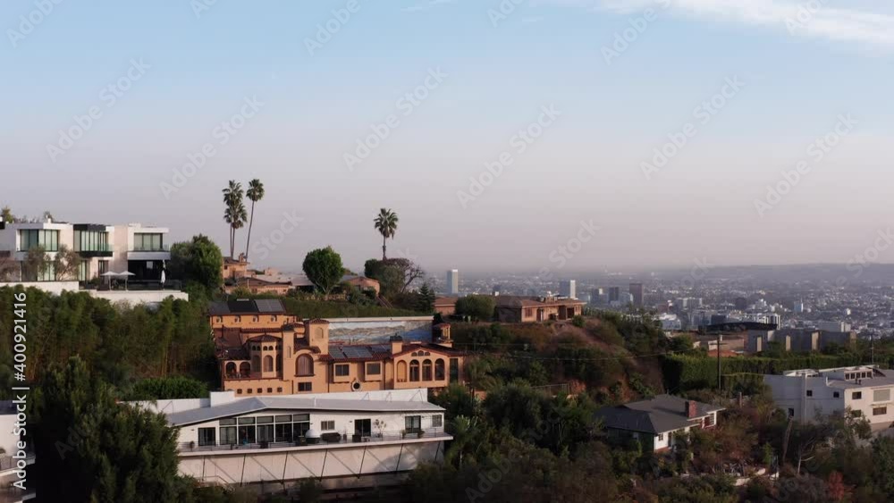 Aerial shot flying over a hill to reveal the city of Los Angeles. 4K Aerial shot flying over a hill to reveal the city of Los Angeles. 4K