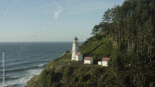 Medium speed tracking across Haceta Head lighthouse in Oreogn photo