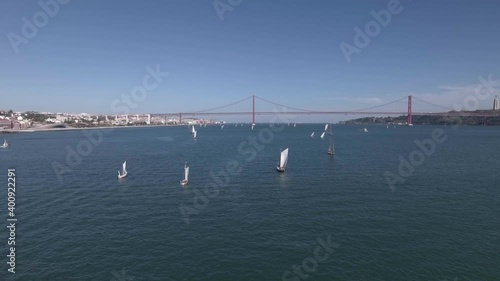 boats in a regatta in river tagus Lisbon Portugal aerial shot 4k