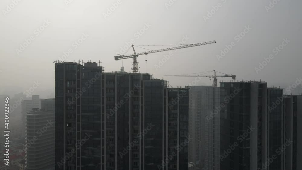 Construction site in heavy haze air pollution, downtown city building in fog. Environmental conservation, business, industry concept b-roll footage. Highly polluted air and cityscape of Shanghai China Construction site in heavy haze air pollution, downtown city building in fog. Environmental conservation, business, industry concept b-roll footage. Highly polluted air and cityscape of Shanghai China