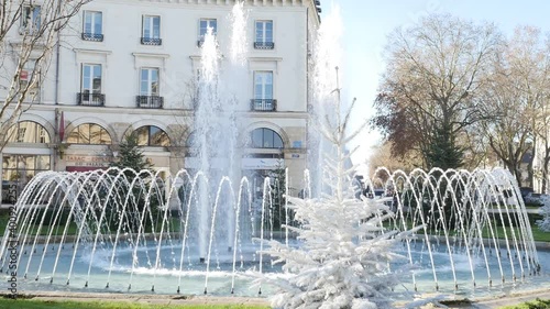 2020-12-19 Tours, France. view of fountain in front of Town hall of the city of Tours, (Mairie de la ville de Tours) with christmas decoration