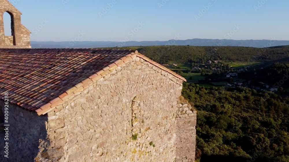 Some aerial shots of the Aumelas Castle (11th century) and its Saint Sauveur chapel, located in the middle of the forest. These buildings are located in the region of Herault, southeast of France. Some aerial shots of the Aumelas Castle (11th century) and its Saint Sauveur chapel, located in the middle of the forest. These buildings are located in the region of Herault, southeast of France.