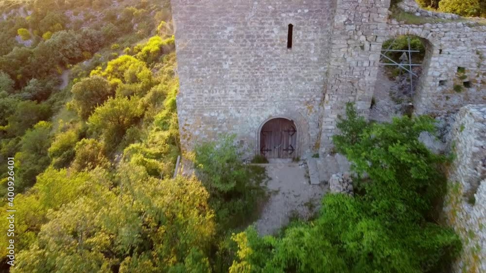 Some aerial shots of the Aumelas Castle (11th century) and its Saint Sauveur chapel, located in the middle of the forest. These buildings are located in the region of Herault, southeast of France. Some aerial shots of the Aumelas Castle (11th century) and its Saint Sauveur chapel, located in the middle of the forest. These buildings are located in the region of Herault, southeast of France.