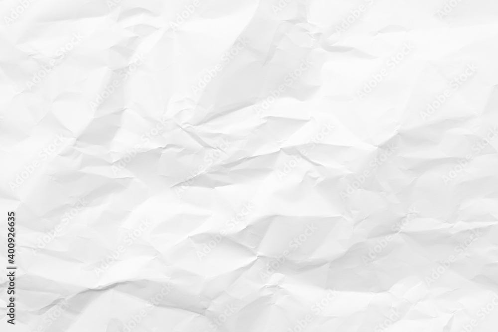 White crumpled paper texture background. Clean white paper. Top view. White crumpled paper texture background. Clean white paper. Top view.
