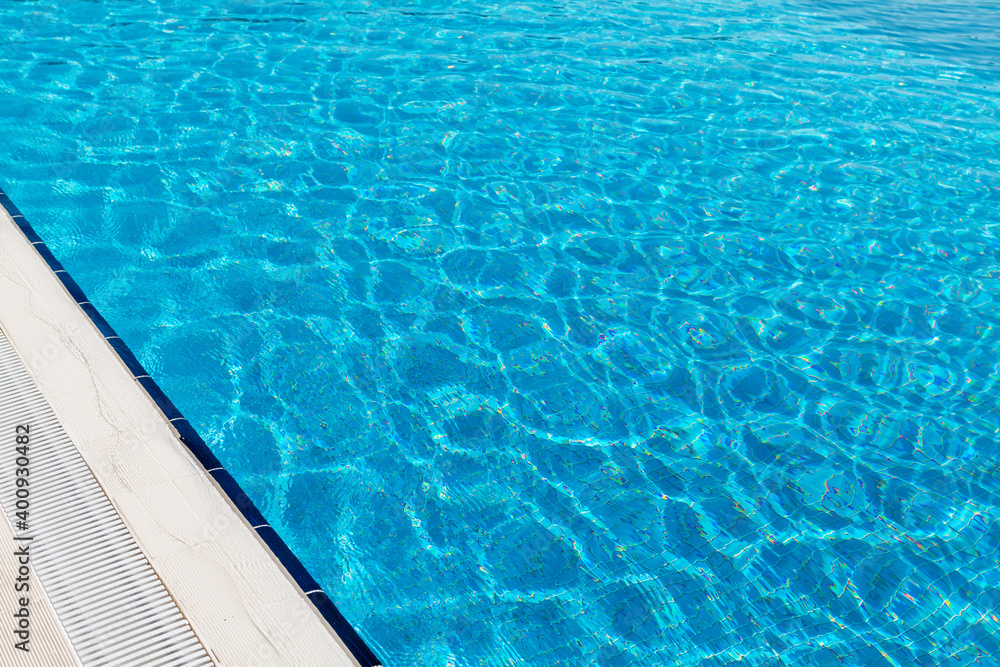 Sunny swimming pool in tropical resort
