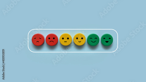 Colorful cubes with emotional faces in the form of a charged battery. Full charge symbol. fullness of energy