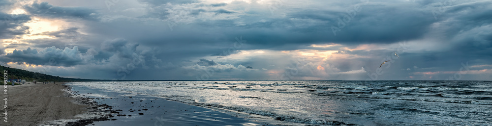 Panoramic view on a stormy beach of the Baltic Sea, concept of ecologically clean, safety and healthy nature tourism in Europe