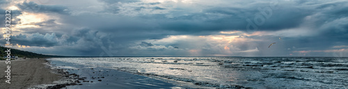 Panoramic view on a stormy beach of the Baltic Sea, concept of ecologically clean, safety and healthy nature tourism in Europe