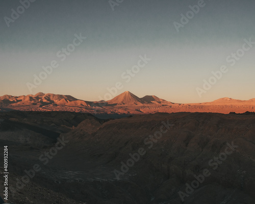 View of the mountains and a vulcano in the desert during sunset