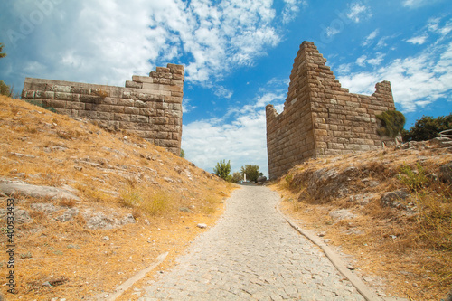 Mindos Gate in Turkey Ruins of a fortress in Turkey. Road, blue sky. photo