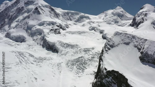 High definition drone aerial video flying high over Swiss alps near Zermatt, Switzerland.
