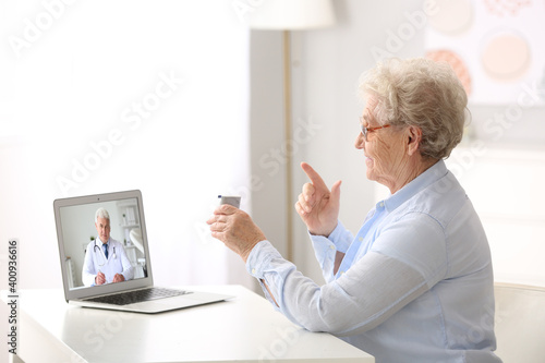 Sick senior woman getting o...