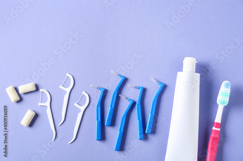 Toothbrushes for dental braces  floss and paste on color background