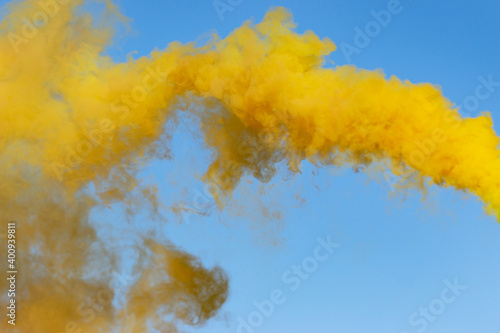 Fototapeta Naklejka Na Ścianę i Meble -  yellow smoke on a blue background