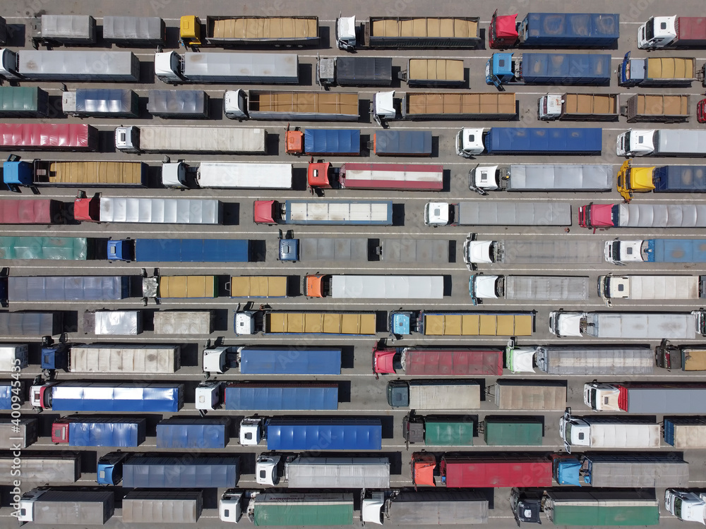 Top view of trucks standing in line for unloading at the port.
