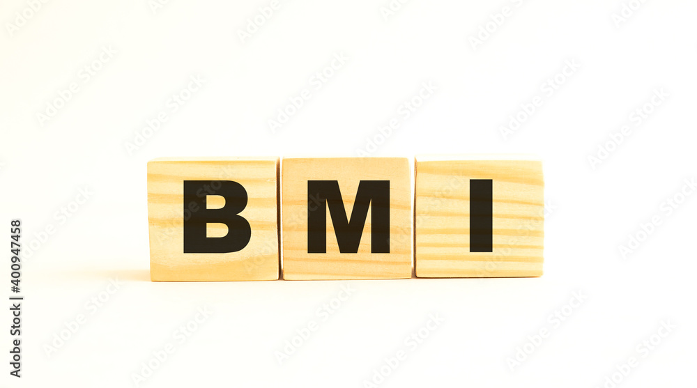 The word BMI. Wooden cubes with letters isolated on white background. The word BMI. Wooden cubes with letters isolated on white background.