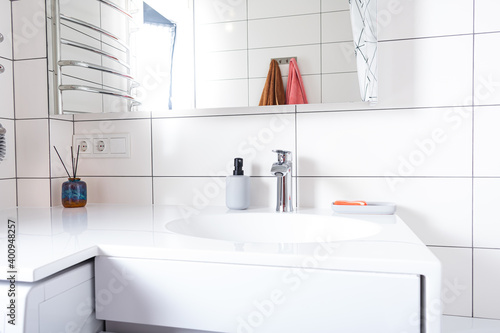Modern bathroom sink and faucet. Stylish vessel sink on light countertop in modern bathroom
