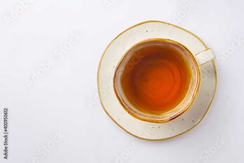 Cup with green tea over white background. Hot tea for cold weather.