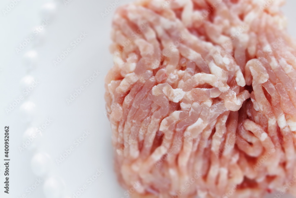 Prepared minced chicken on dish for cooking ingredient