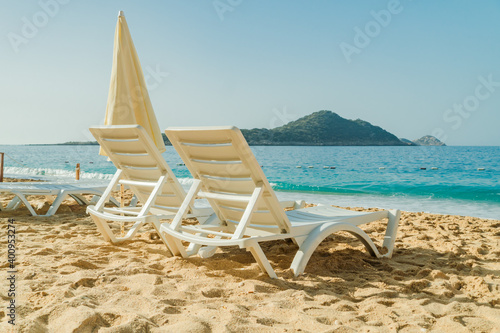 Lounge chairs and umbrellas on Kaputas Beach at summer day