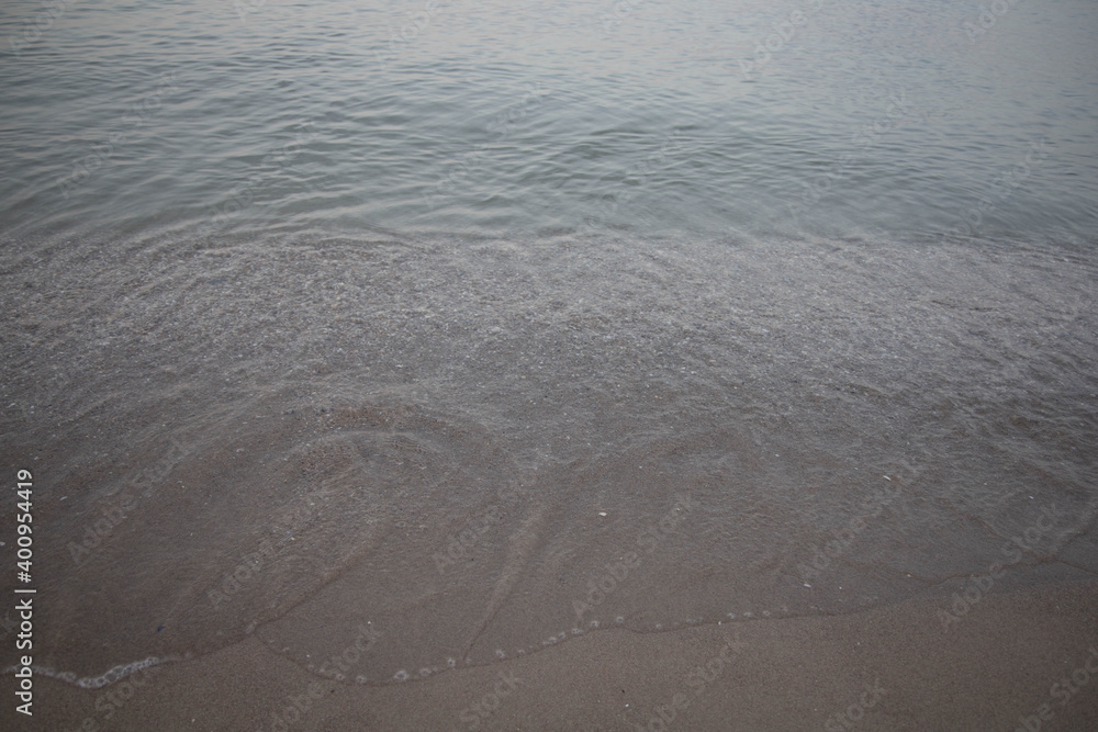 Water surface abstract background, play of speck of ligth, motion blur, gray brown blue marine gradient. Water surface abstract background, play of speck of ligth, motion blur, gray brown blue marine gradient.
