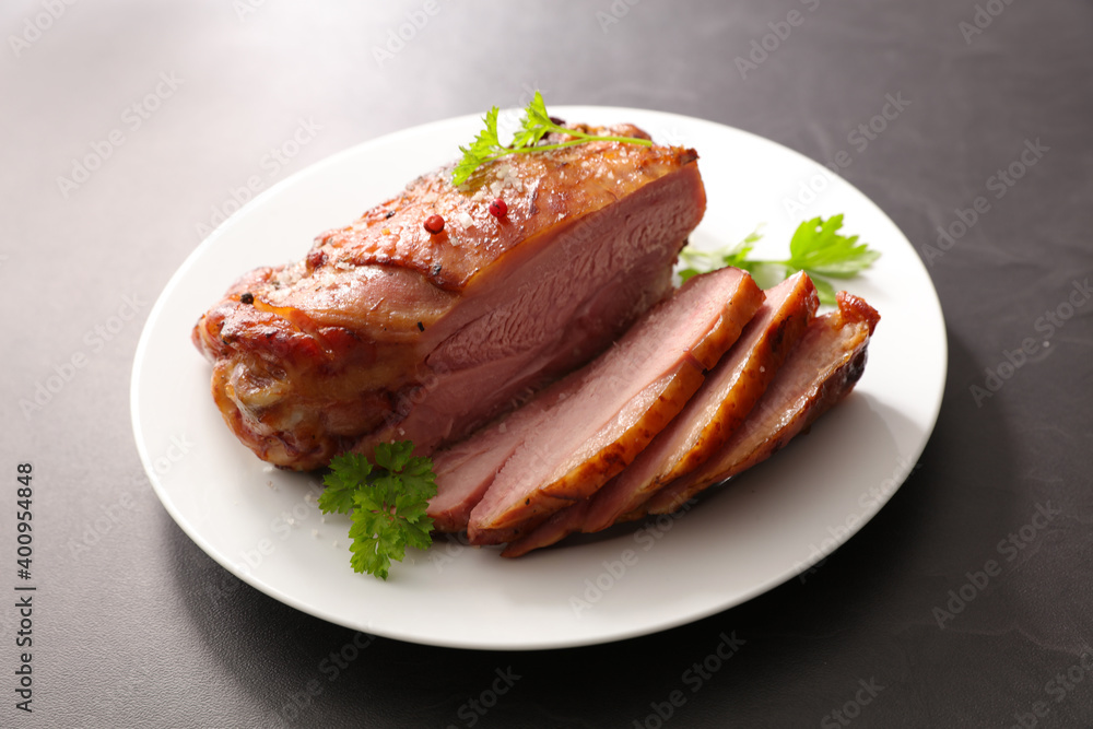 glazed ham sliced on plate