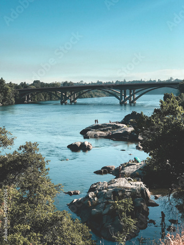 Bridge over river during spring.