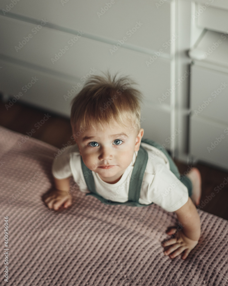 Fototapeta premium Baby boy at home. Top view