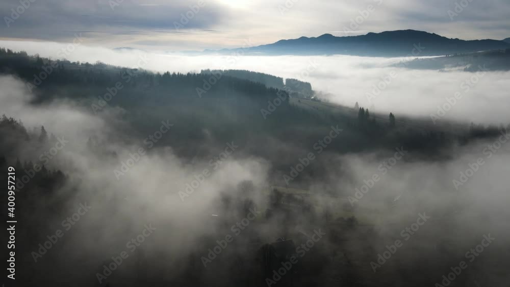 Flying through the clouds above mountain tops. High peaks wonderful morning sunrise natural Landscape Flying through the clouds above mountain tops. High peaks wonderful morning sunrise natural Landscape