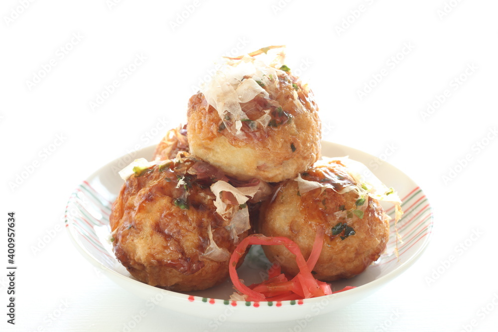 Japanese summer street food, Takoyaki octopus ball on dish Japanese summer street food, Takoyaki octopus ball on dish