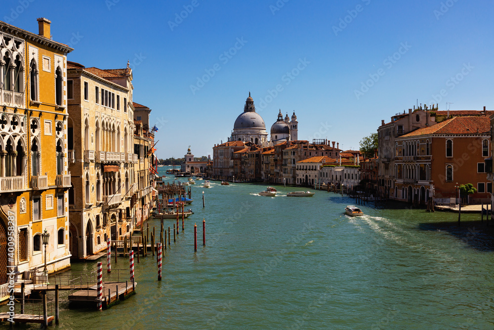 Panorama of Grand canal with boats and gondolas on sunny summer day in Venice. Italy
