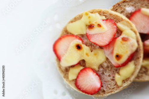 homemade sugar and cheese with strawberry in English muffin sandwich