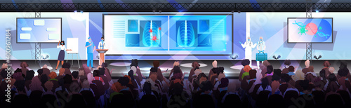 doctors in masks presenting coronavirus cells at tribune medical conference covid-19 pandemic concept lecture hall interior horizontal full length vector illustration