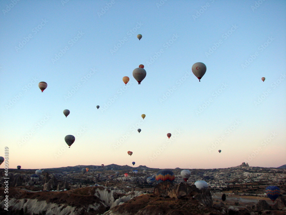 The unsurpassed beauty of an infinite number of balloons rising above the valley into the morning sky illuminated by the colors of the sunrise.