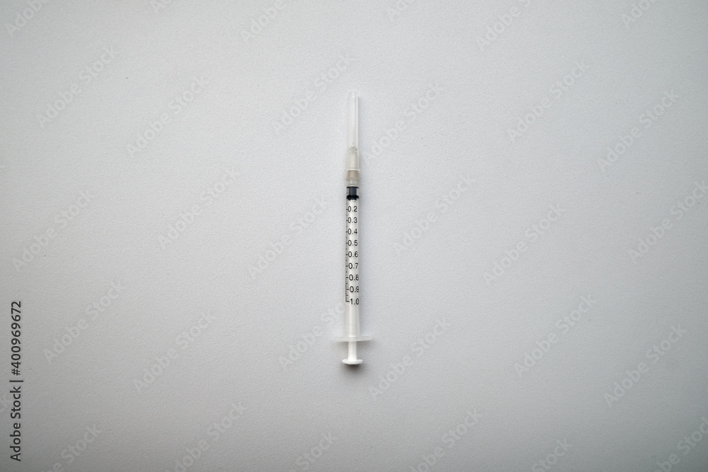View of syringe closeup on white background. View of syringe closeup on white background.