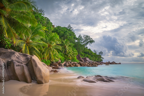 clouds at tropical beach anse georgette on praslin, seychelles