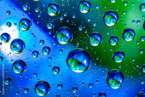 Wallpaper Mural Abstract background about water or space. Multicolored stylish drops. Unusual splashes. It looks like the universe, planets and stars. Torontodigital.ca