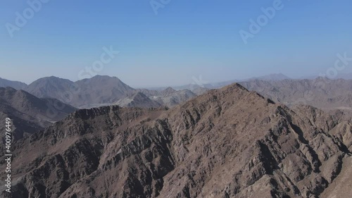 4k Drone footage: Unveiling shot of UAE Mountain range, Khorfakkan mountains, Sharjah, United Arab Emirates. photo