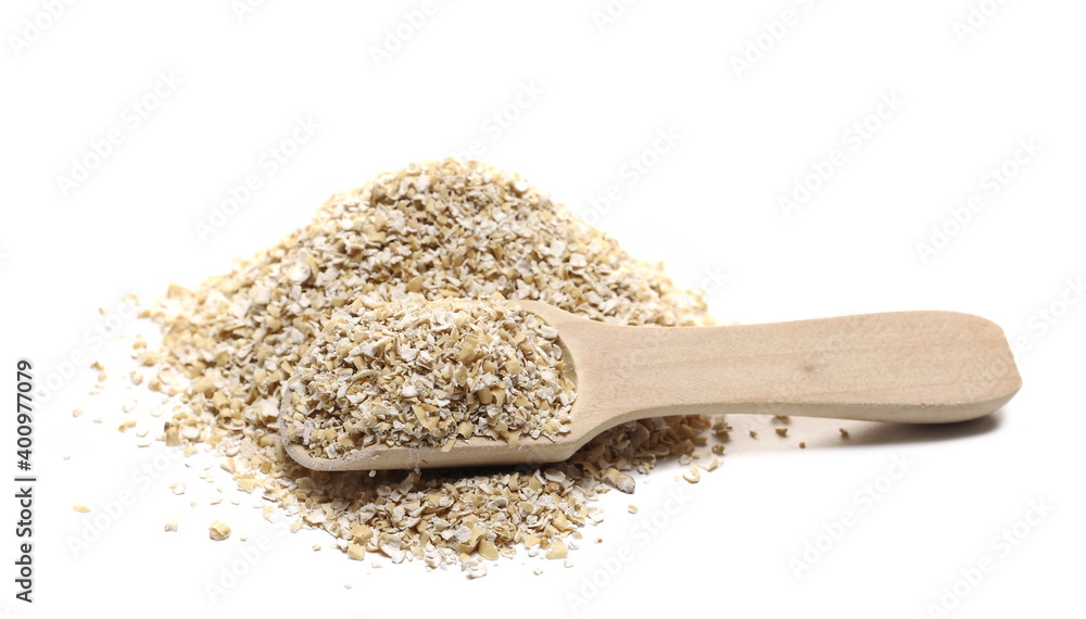 Oat bran pile with wooden spoon isolated on white background Oat bran pile with wooden spoon isolated on white background