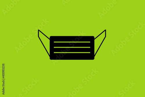graphic of black face mask on green background