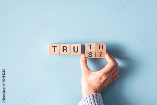 Hand turned wood cube and changes the word "Trust" to "Truth".