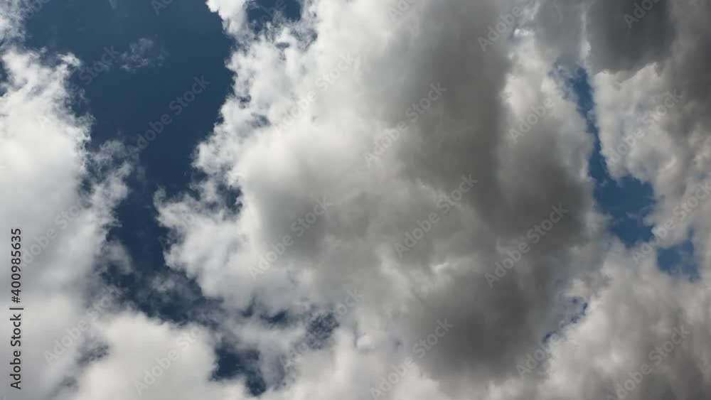 Large cumulus clouds in the blue summer sky. Timelapse. Cloudy sky as background. Vertical video.
Large cumulus clouds in the blue summer sky. Timelapse. Cloudy sky as background. Vertical video.