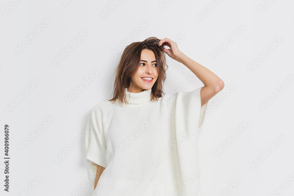 Atmosphere. Portrait of beautiful brunette woman in comfortable soft longsleeve isolated on white studio background. Home comfort, emotions, facial expression, winter mood concept. Copyspace. Atmosphere. Portrait of beautiful brunette woman in comfortable soft longsleeve isolated on white studio background. Home comfort, emotions, facial expression, winter mood concept. Copyspace.