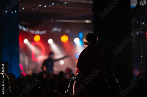 Photo of many people enjoying rock concert in nightclub