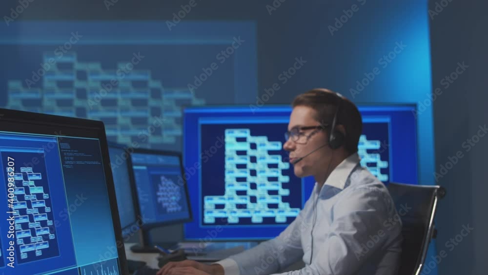 Call-center workers are speaking with the clients by headset. Workplace of the professional support operators. Teamwork concept. Call-center workers are speaking with the clients by headset. Workplace of the professional support operators. Teamwork concept.