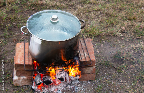 picnic in nature, a saucepan on the fire for hot tea
