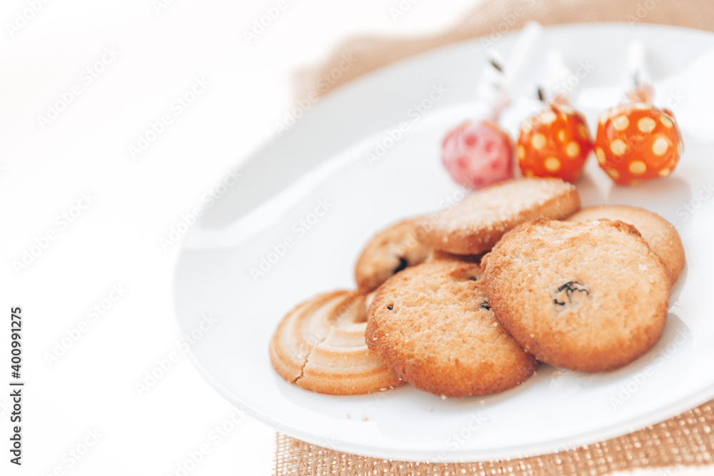 Butter cookies in a white plate on a white background. Butter cookies in a white plate on a white background.