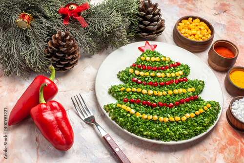 front view green salad in new year tree shape with seasonings on light desk color salad meal xmas photos