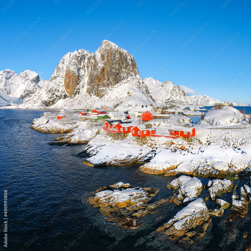 Fantastic winter view on Hamnoy village and Festhaeltinden mountain on background