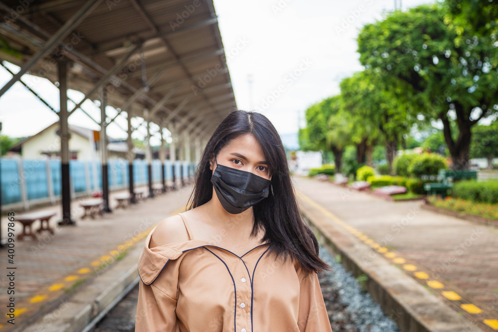 Fototapeta premium .Asian woman wearing a mask to prevent COVID-19 or COVID-19 concept